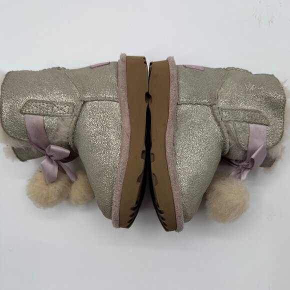 UGG Infant Girls Metallic Gold Sheepskin Bow Booties With Pom-Poms - Picture 3 of 11